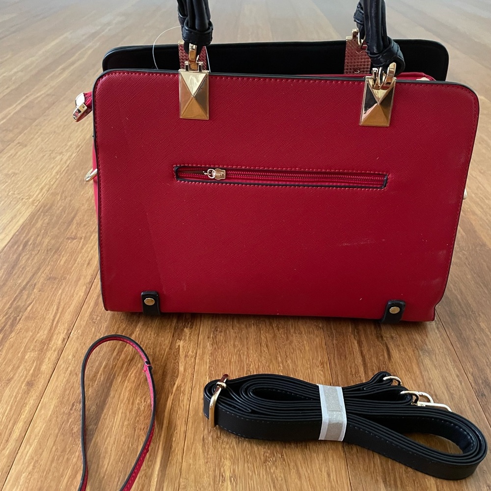 Red purse w/arms straps &over theshoulder strap. Many compartments. Brand new